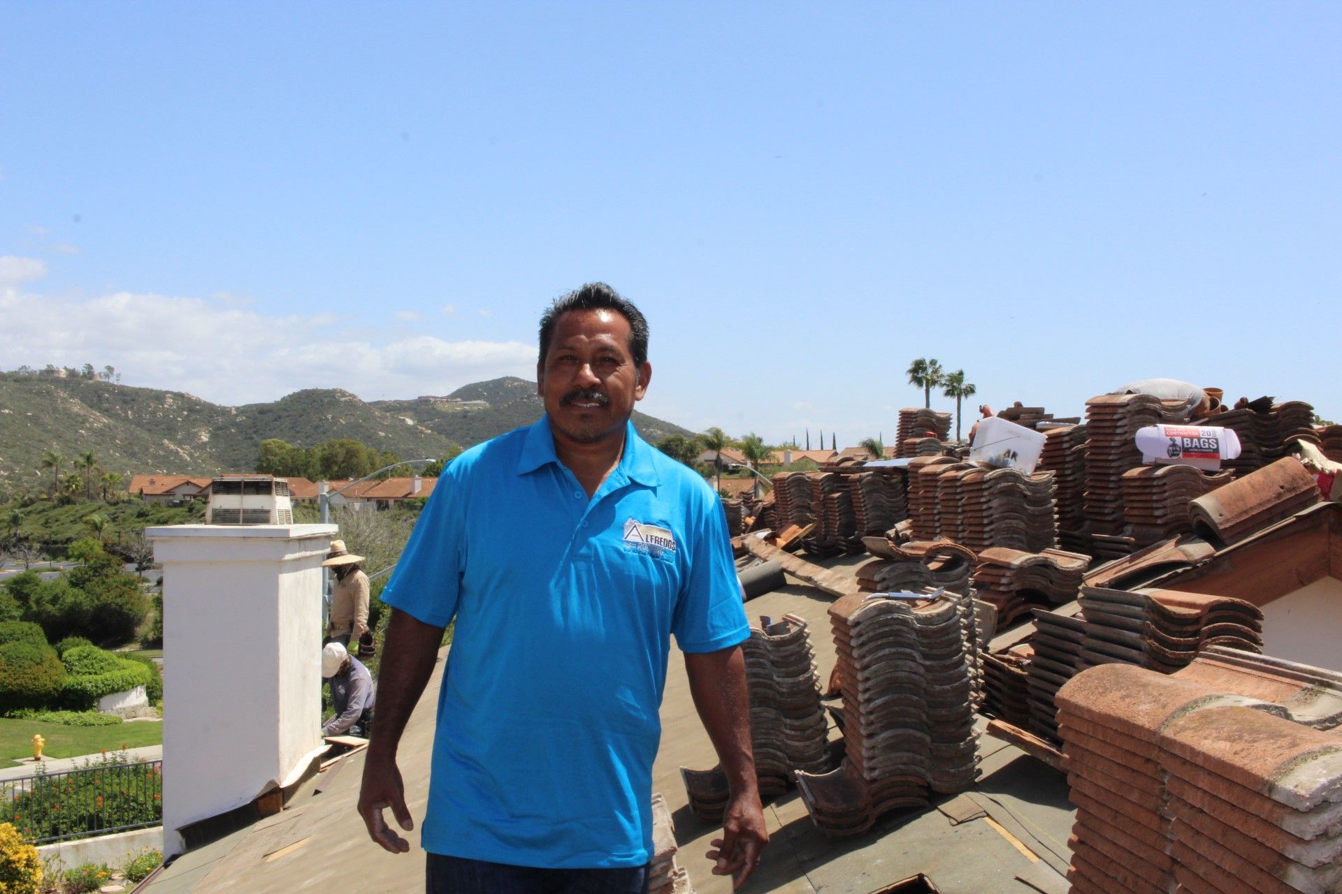 Owner Alfredo Galindo on a clay tile re-roof in North County San Diego