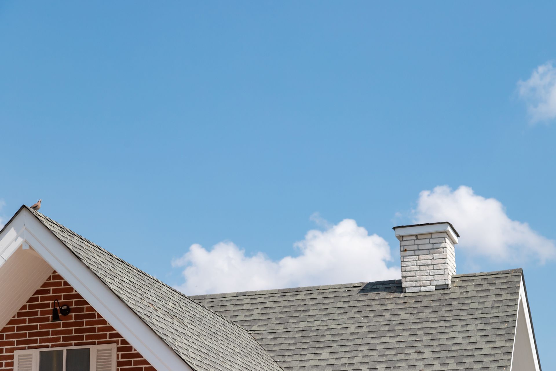 Residential shingle roofline and chimney