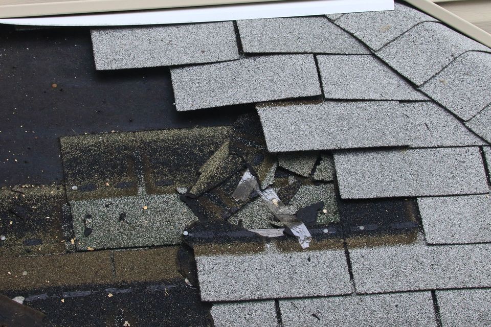 Shingle roof repair in progress